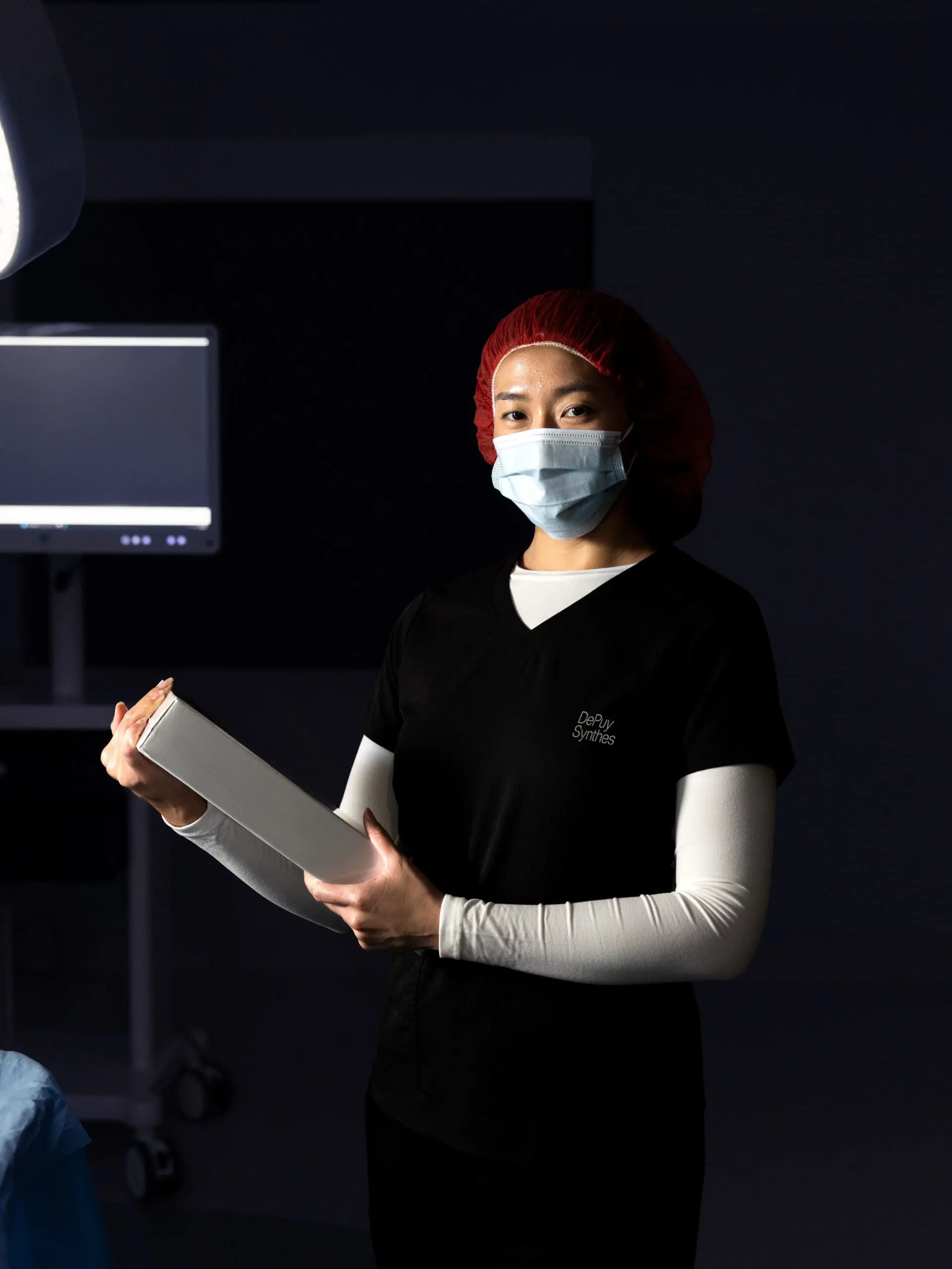 Surgeon with mask and red cap